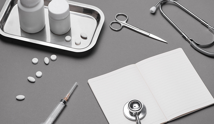 Tools, notes and medication on a table.